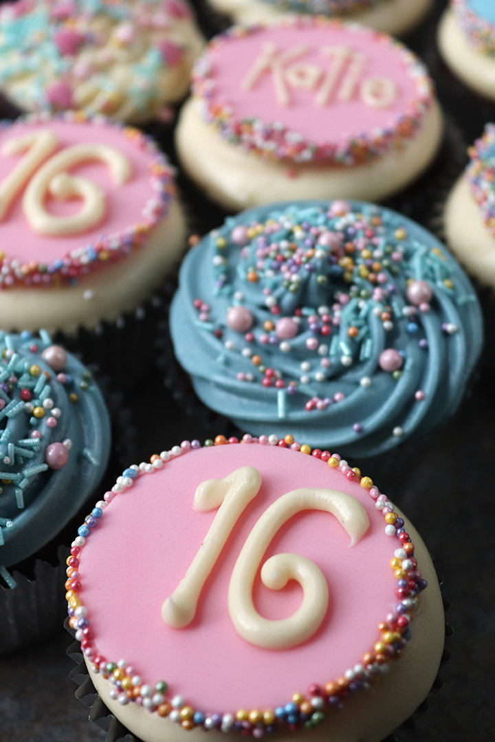 Gluten-free, egg-free, nut-free Chocolate Cupcakes, with cream cheese frosting. Decorated with sugarpaste plaques and freefrom sprinkles. Delivery in London