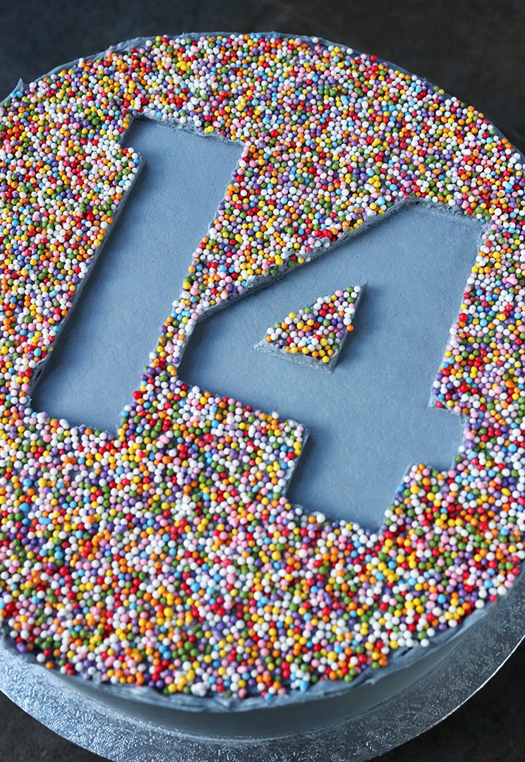 Gluten-free Sprinkles Cake: gluten free, dairy free chocolate & olive oil cake filled with choc fudge buttercream. With blue vanilla frosting and freefrom sprinkle decoration. All ingredients glutenfree and milkfree