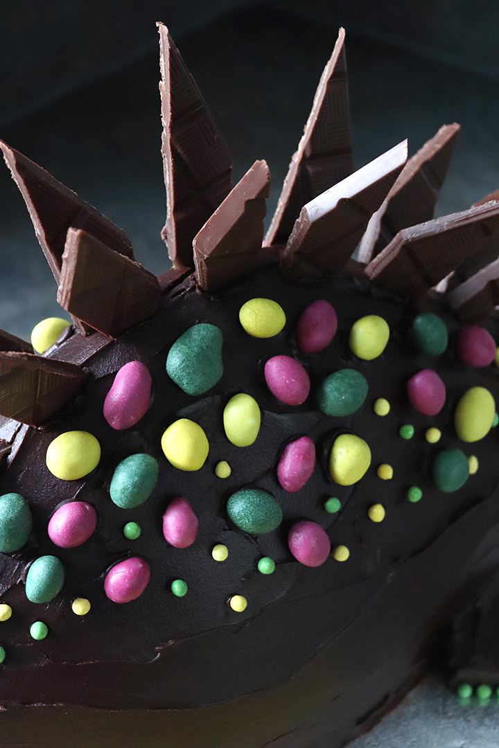 Stegosaurus Cake: organic glutenfree dairyfree vanilla sponge, covered with organic dark ganache and decorated with chocolate spikes and sugar-coated peanuts. All ingredients and decorations gluten-free and milk-free. Made to order. Delivery in London