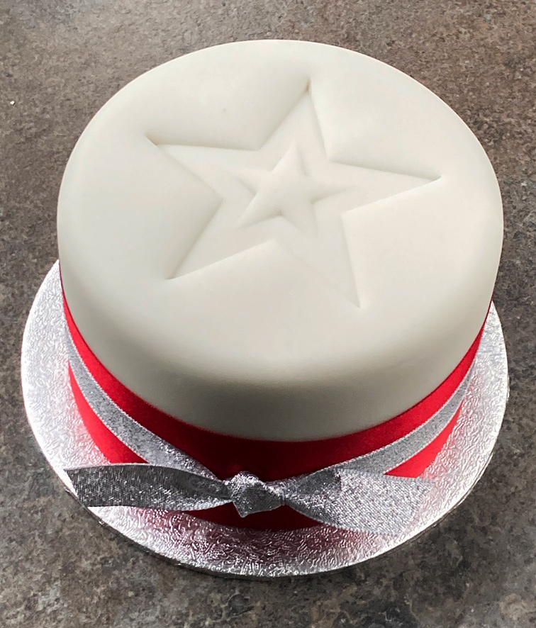 This beautiful glutenfree Christmas Cake can be posted to UK addresses and abroad and delivered by hand in London. Moist and dark, it is made with organic fruit and toasted almonds steamed in Appleton Kingston 62 Jamaia rum. Sweetened with organic blackstrap molasses, no added sugar. Covered with marzipan and soft white icing. Gluten free. This luxury fruitcake is the perfect Christmas gift, or to share with friends and family 